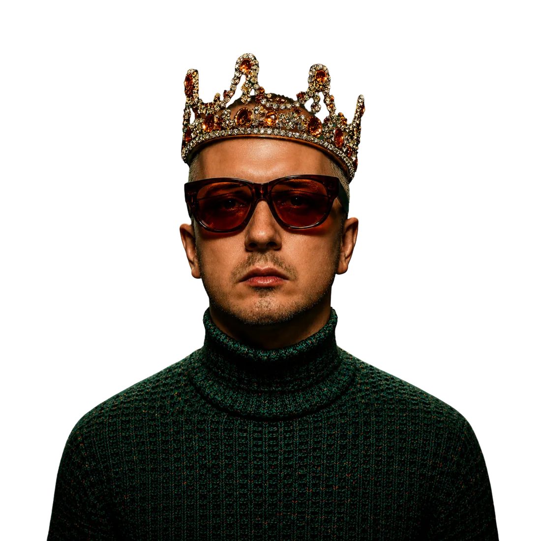 A portrait from the studio: a man in a jewelled crown and red-tinted glasses, cut out against the dark